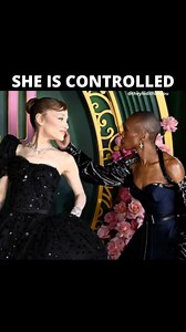 The stage no longer feels like art—it feels like ritual. In the videos, Ariana Grande moves under Cynthia Erivo’s shadow. Every touch, every gesture, is not affection but a reset, a reinforcement of control, a spell renewed. 🕯 Not harmony. Domination. - Cynthia’s hands linger, not as support, but as command. - Ariana’s presence bends, reshaped by invisible strings of energy. - What looks like choreography is in truth a ritual of subjugation. 👁 Not performance. Programming. - The atmosphere tur