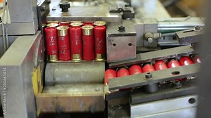 Process of production of bullets. Industrial concept. Factory equipment and macine.