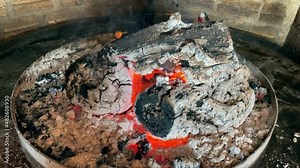 Cooking national dish of lamb in restaurant of Patagonia, Chile