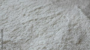 Towel texture. super close up video 4k. Details of a white terry towel. textile background