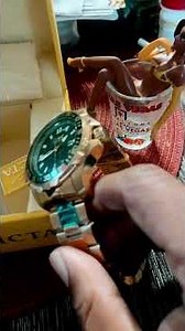 Invicta ￼ watch 14 karat gold with green face ￼￼￼ gold and green together