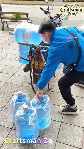 The water delivery worker loaded 10 19 liter water buckets onto the motorcycle
