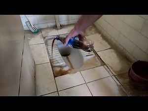 Cleaning toilet using coca cola thumps up