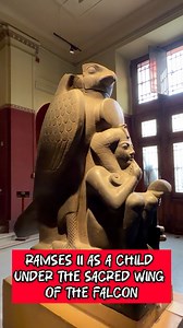 Ramses II as a Child Under the Sacred Wing of the Falcon This monumental statue presents one of the most intellectually refined examples of symbolism in ancient Egyptian art. It depicts Ramses II in the form of a child, seated under the divine protection of the falcon god Hauron. The gesture of the finger to the mouth does not symbolize silence. In ancient Egyptian art, it is a clear sign of childhood, directly referring to the element “ms” meaning “child,” which forms a core part of the king’s 