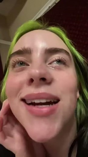 Billie Eilish sticking a ukulele in her mouth ~ second video of Billie's tiktok