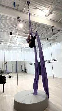 Graceful Aerial Silks Performance in a Studio Setting