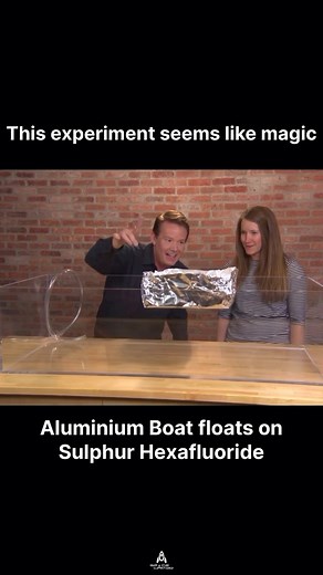Science experiment seems like Magic | Aluminium boat floats on Sulphur Hexafluoride An aluminum foil boat can float on sulfur hexafluoride (SF₆) because SF₆ is a very dense gas, about six times denser than air. This high density allows the light aluminum foil boat to displace enough SF₆ to generate a buoyant force, making it float. This phenomenon is due to the principle of buoyancy, where an object will float if it displaces a fluid (in this case, SF₆ gas) with a weight equal to its own. Follow