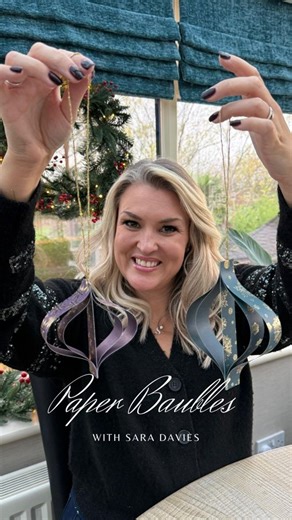 Crafter's Companion on Instagram: "✨ Make your Christmas tree extra special with easy DIY paper baubles! Watch @SaraDaviescc show a step-by-step tutorial using our gorgeous papers. 🎄✂️ These simple, festive decorations are perfect for adding a handmade touch to your holiday décor. Don’t forget to save this idea and try it at home! #SaraDavies #DIYChristmasDecor #PaperBaubles #ChristmasCrafts #CraftersCompanion #Papercrafting #FestiveCrafts #HandmadeChristmas #CraftWithSara"