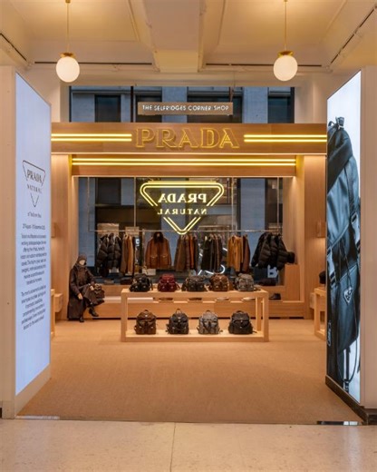 85K views · 3.1K reactions | A space transformed. Prada Natural - the pop-up at The Selfridges Corner Shop in London - reimagines architecture with natural wooden volumes, suspended neon logos, and linear graphics, reflecting a metropolitan landscape in motion. From 27 August to 20 September 2025. Discover more at: https://tinyurl.com/ypbrxeby #Prada | Prada | Facebook
