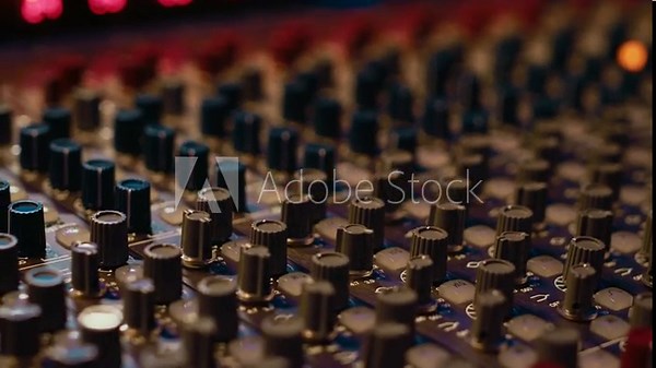 Empty professional studio with control desk mixer and audio recording software on pc, music production. Soundproof control room equipped with switchers buttons, sliders and pre amp knobs.