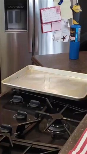 Every year we get the kids a tool and something science. This years tools were propane torches, which worked with the science: 12 beakers, 4 bottles of potassium chlorate, and a bag of gummie bears. Potassium chlorate is KClO3, potassium chloride with three loose oxygen atoms just eager to burn stuff up. Melt the potassium chlorate powder in the beaker with the torch, drop in one gummie bear. | John Scharine