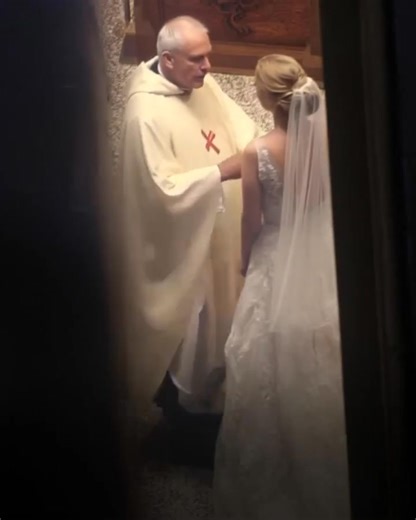 I've been a priest for over twenty years and thought I'd seen it all—until this wedding.I t began like any other Saturday ceremony. The groom was cheerful, guests were smiling, music played softly. Then the bride walked in—graceful, beautiful, but something was off. Her smile was forced, her eyes fixed on me, not her groom. Pleading. I asked for their vows. The groom handed his over. When she gave me hers, her hands trembled. I unfolded the paper and froze. Between the lines of her vows were thr