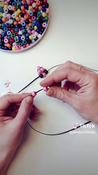 Bead Lizard 🦎 Who remembers this throw back arts and crafts project!?! Straight from camp in the 90's! Make your own DIY Lizard using Plastic Lacing and Crow Beads! For a more detailed explanation of how to create this beaded keychain check out the link in bio under craft corner. This may be an oldie craft, but it's a goodie! Thanks to @Art Therapy in Real Life for the inspiration for this video! #jandjcrafts #craftcorner #craftsforkids #kidscrafts #artsandcrafts #campcrafts #diycraft #beads #b