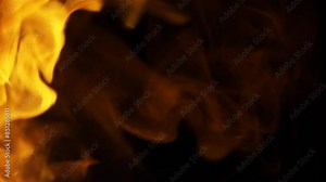 Closeup footage of fire explosion with moving flame isolated on a black background with a copy-space