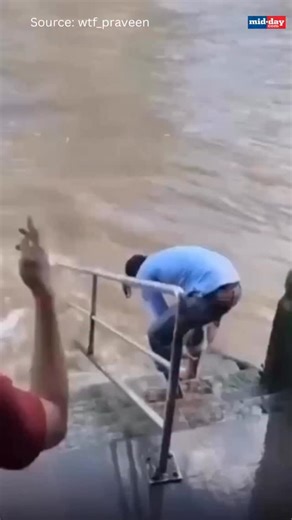 38K views · 851 reactions | A viral video showing a man, described online as “Indian,” dipping his feet in London’s River Thames has triggered a heated debate on civic sense and cultural behaviour. While some criticised it as inappropriate, others argued the man’s nationality is unconfirmed and the outrage is exaggerated. Source: wtf_praveen/X | MiD DAY | Facebook