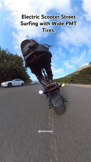 Electric Scooter Street Surfing with Wide PMT Tires.