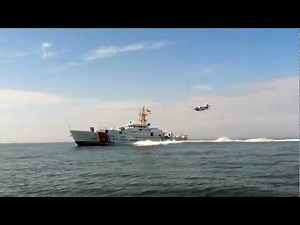USCGC Bernard C. Webber (WPC-1101) with HC-144A flyover - starboardside