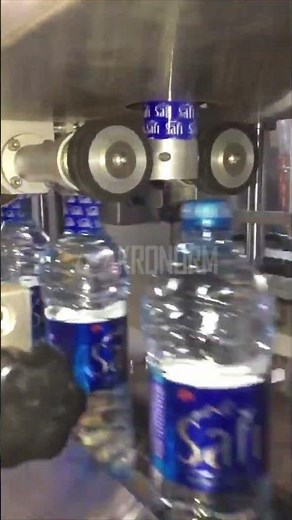 Colocador de Precintos de Garantía en el Tapón con Sleever | Automatización Protección del Producto