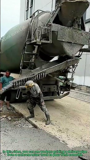 Concrete Pouring: Workers Guide the Delivery Pipe