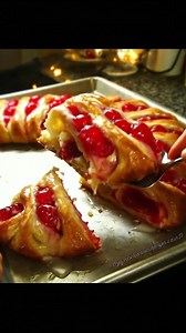 Every holiday season, this Candy Cane Cheese Danish becomes the star of our breakfast table, tempting everyone to sneak a slice (or two!) before the coffee brews. Trust me, you won't be able to resist that creamy filling and sweet cherry topping! Recipe’s waiting for you in the comment 👇 | Recipes & Cooking Guide