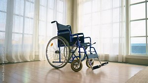 Empty wheelchair in clinic lobby. Wheelchair used for physical recovery service on health care insurance, paralyzed injured patients. Healthcare, medicine, medical objects helping to live concept. Stock Video