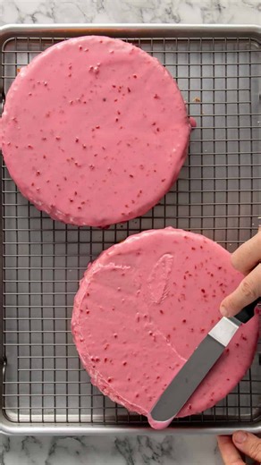 Nick Makrides on Instagram: "I love the colour of this cake, but the texture’s what gets me. Soft vanilla sponge, thick raspberry jam and smooth cream is one of my favourite combos. Covered in raspberry glaze and coconut for that perfect finish. Comment 'recipe' and I'll DM you the recipe! https://thescranline.com/raspberry-lamington-sponge-cake/"