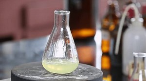 Boiling the soap and chemicals in an Erlenmeyer flask on hot plates .Quality Control Laboratory. Research Lab. Soap Factory