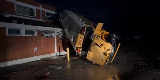 Bus thrown on roof of high school after severe storm