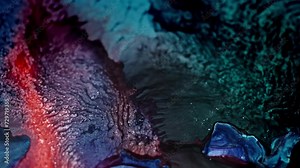 Vibrant ink colors merging in water, creating an abstract, fluid art texture