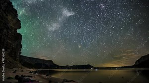 In the crystal-clear night sky, countless stars glitter brilliantly. The Milky Way flows across the sky, glowing with an ethereal white light.