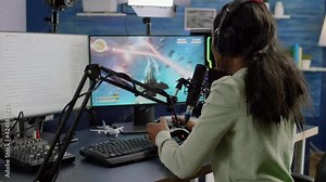 Streamer cyber performing space shooter video game holding controller on RGB powerful computer talking with players on stream chat and microphone during professional competition. Player man streaming