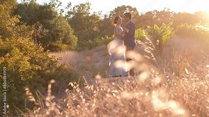 Lovely Indian Hindu Groom And Bride With Scenic Sunset Nature Background. Wide Shot
