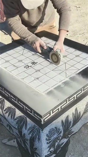 forming a table with a box-shaped top using a grinding tool