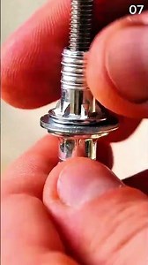 Gripping threaded metal fitting with tool for adjustment.