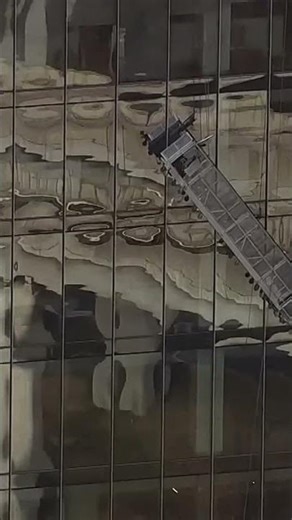 2 window washers seen hanging on side of high-rise building during rescue in Virginia