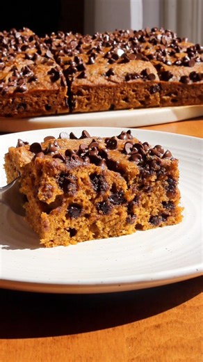 5.6K views · 34 reactions | ⬇️ Recipe below!  Pumpkin Chocolate Chip Cake is a super soft and fluffy cake full of sweet pumpkin, warm spices, and gooey chocolate. It’s the perfect fall bake! 朗 Recipe here - https://taffeybakery.com/easy-pumpkin-chocolate-chip-cake/ or comment RECIPE to get it sent directly to your inbox! | Taffey Bakery | Facebook