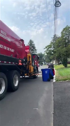 Garbage truck Side loader Collecting Recycling On Thursday Route