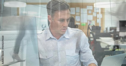 Digital video shows a man programming with global business tech and networking animation.