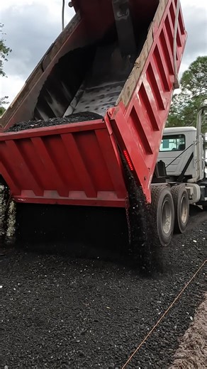 Quick and easy. Laying down a quick load of asphalt millings!