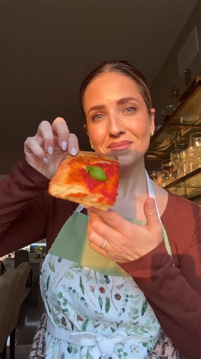 Laura Vitale on Instagram: "You know the bread basket you at some really good Italian restaurants and they include those squares of tomato pie that are undoubtedly the best part of that basket?! Well this is IT! It’s not focaccia, but also not thin crust, it has no cheese (well usually it doesn’t but sometimes you’ll find some with a sprinkle of parm) and the center is so saucy and fluffy with incredible crunchy and savory edges that just begs to be eaten. The sauce is simple but perfect, extra 