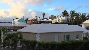 Typical Bermuda colourful houses with a white roof to collect rainwater.