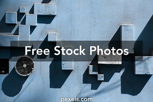 Free A Dark Blu Background With A Rectangle Patterns Photos