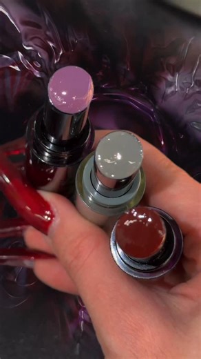 KALEIDOS on Instagram: "Your portal to a modern goth fantasy. 🖤 Saturate your lips in richly pigmented color with our Glassload Lip Melts. A single sweep activates shine that looks like a layer of glass suspended over the lips. This next-gen formula adapts to your vision: build it up and the pigment deepens, transforming into moody, high-impact gloss that sharpens your aesthetic and locks in drama. Which shade are you claiming for your soft goth look? ⛓️ Endgame ⛓️ Geek Out ⛓️ Stranger Complete