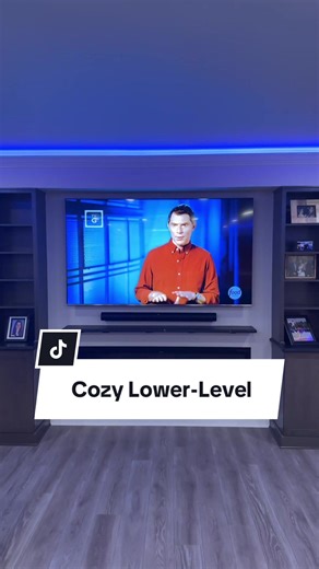 Turn every evening into a movie night in this stunning, cozy basement! 🎞️🍿 #halfwall #designinspo #entertainmentcenter #kitchenette #craftmanship