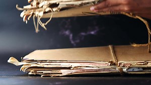 Piling up old used paper folders