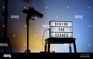 Cinema Light box. Behind the scenes letterboard text on Lightbox. Multi color LED on background. Sillhouette flash snoot hood on tripod. video product Stock Photo - Alamy