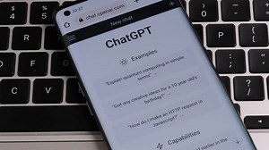 OPEN AI ChatGPT chat bot seen on smartphone placed on laptop keyboard. AI chatbot responded to the question about the ways how to make money online. Stafford, United Kingdom, January 15, 2023.