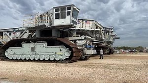 NASA's Crawler Transporter rolls SLS to launch pad