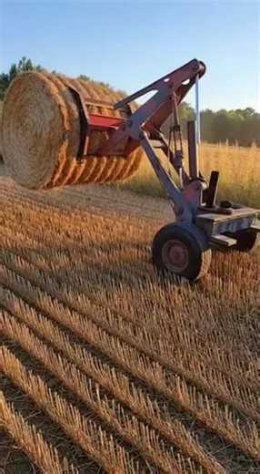 Hay Bale Lifter Mech Tags #HayHarvest #FarmRobot #HeavyLift #RustSteel #PhoneCamera #MechanicalPower