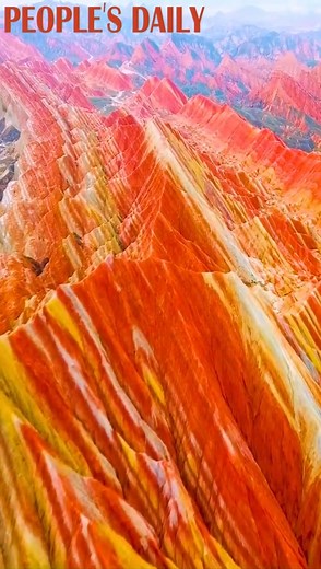 21K views · 1.6K reactions | Enjoy your flight over the "rosy cloud" at a geopark in Zhangye, NW China's Gansu! The Danxia landform, meaning "rosy cloud," is nature's best art formed by reddish sandstone on curvaceous cliffs. #AmazingChina | People's Daily, China | Facebook